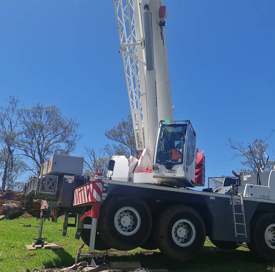 Heavy crane operation on a residential job site